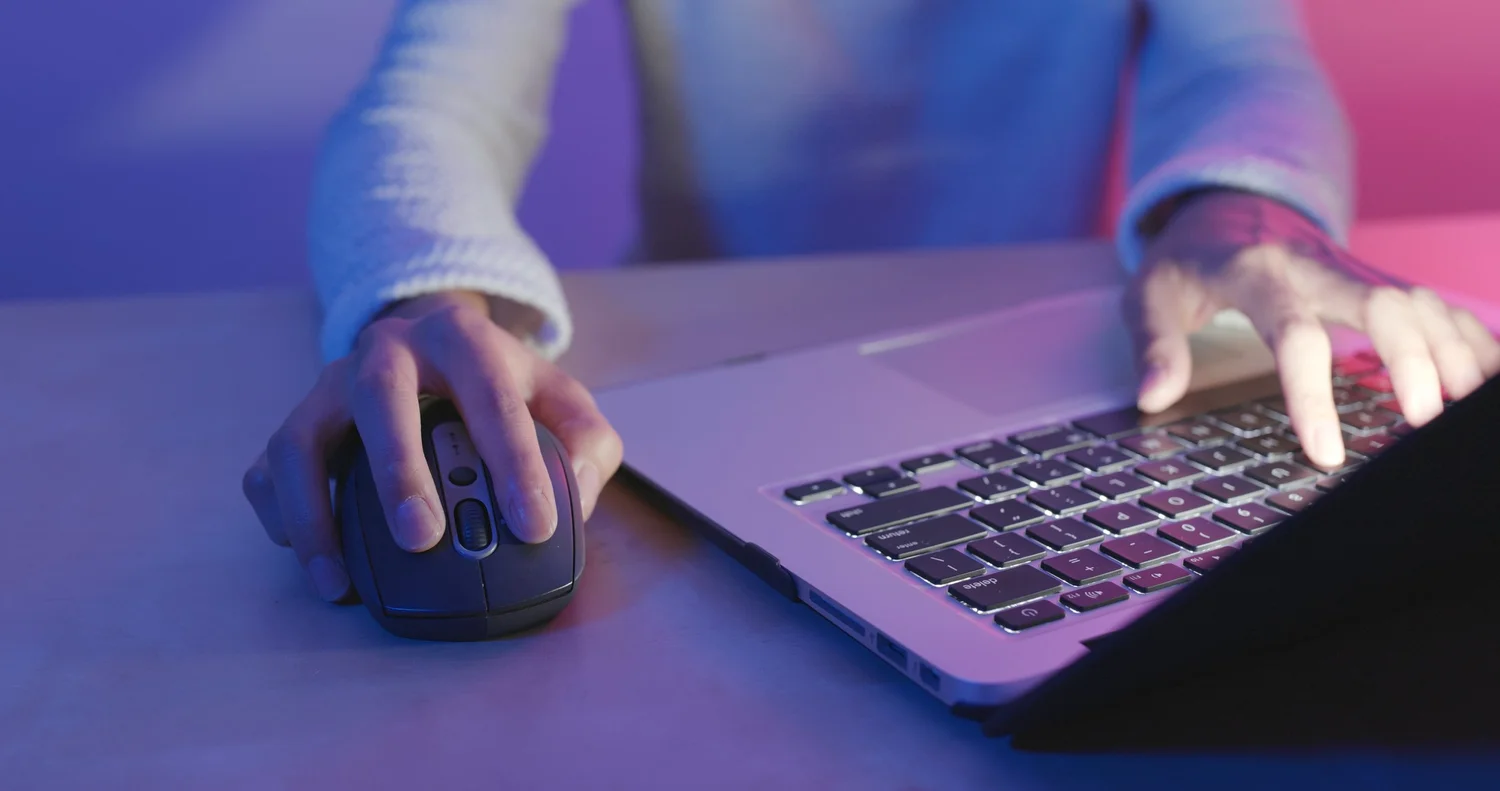 Hands on a laptop
